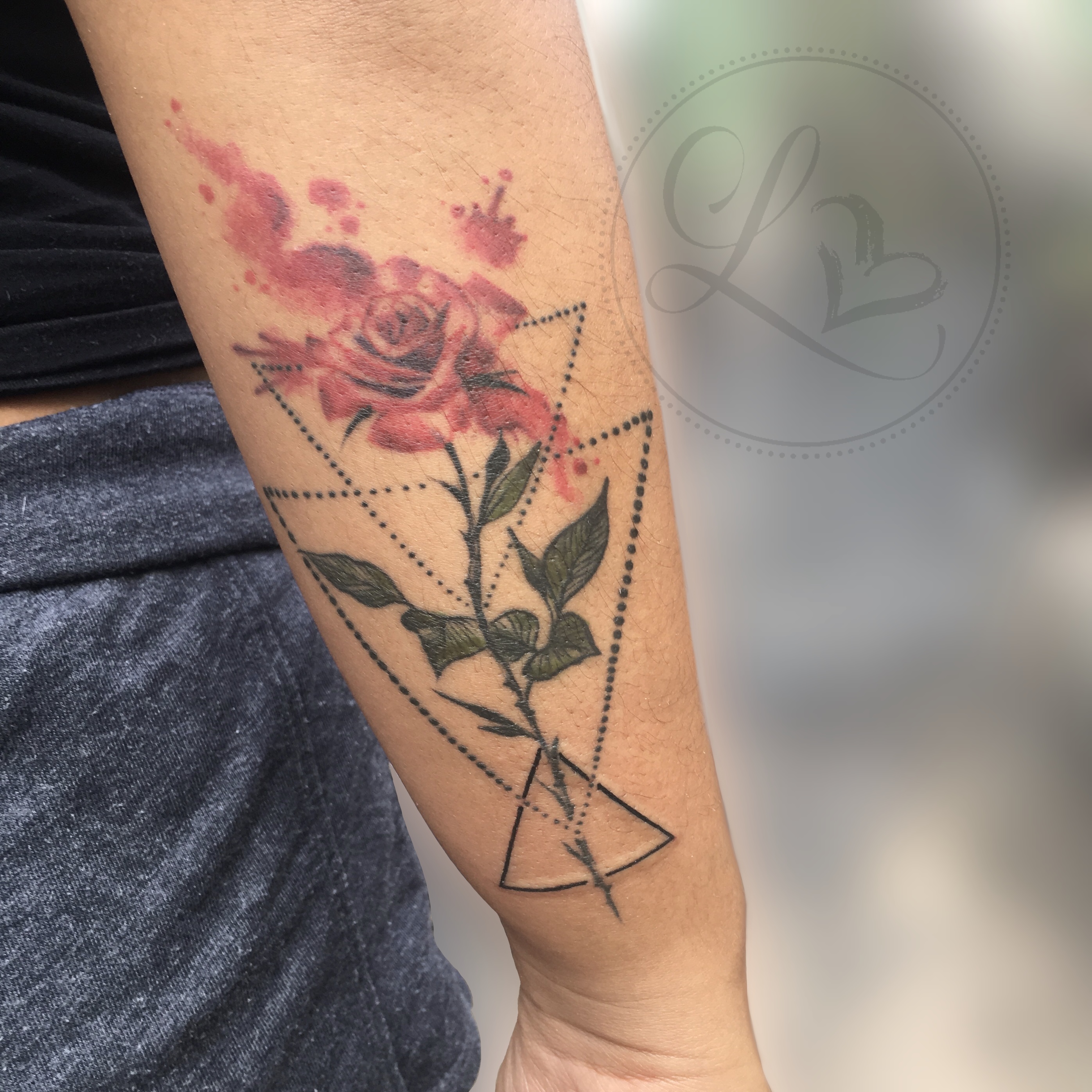 Geometric watercolor rose tattoo