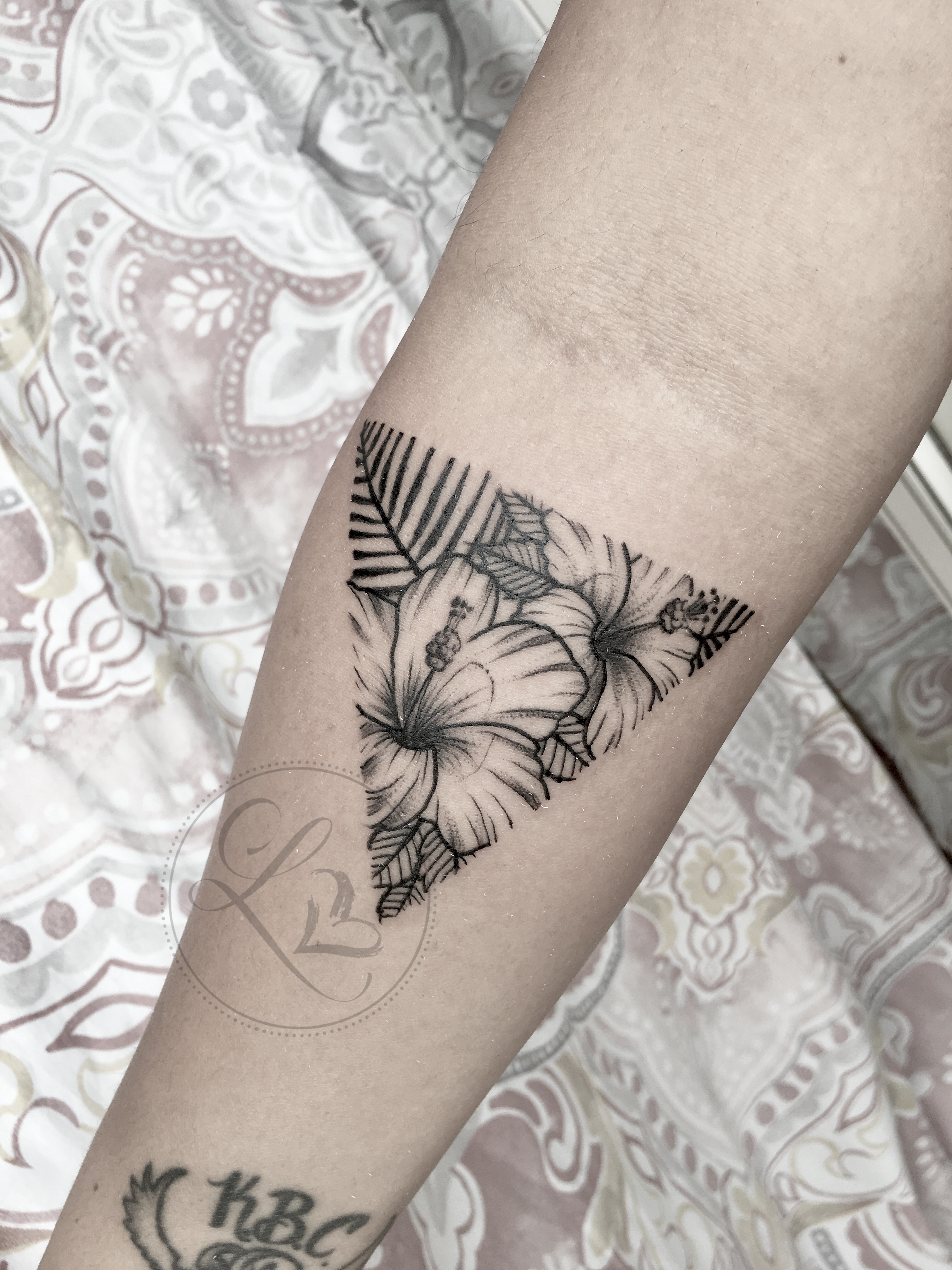 Hibiscus triangle linework tattoo