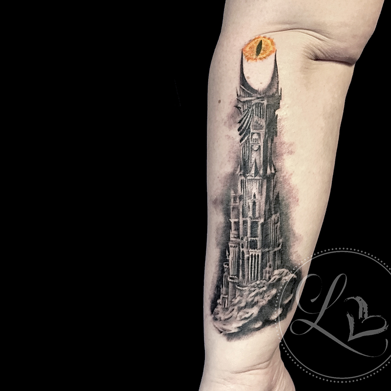 Realistic black and grey tattoo of the Tower of Sauron from the Lord of the Rings