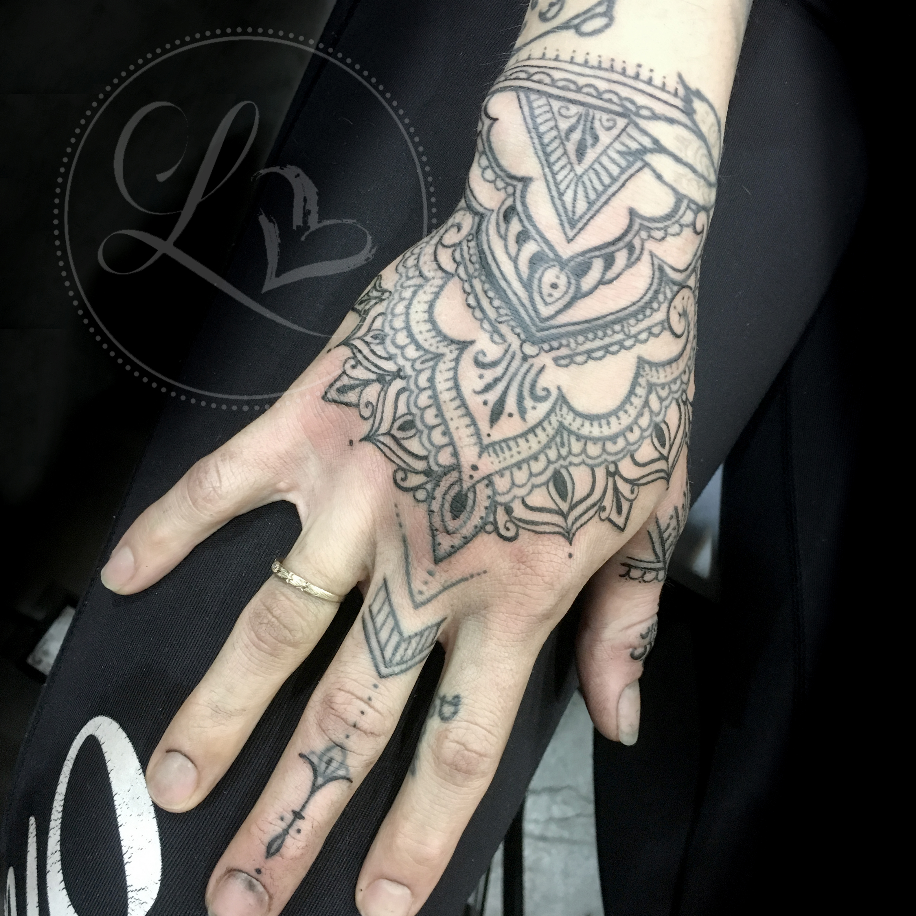 Henna mendhi ornamental freehand hand tattoo