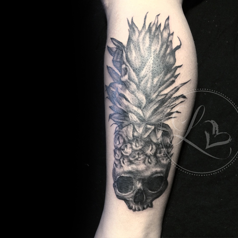 Black and grey realistic tattoo of a pineapple shaped as a skull