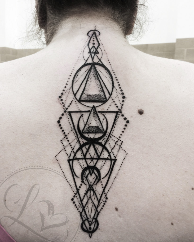 geometric dotwork spine tattoo