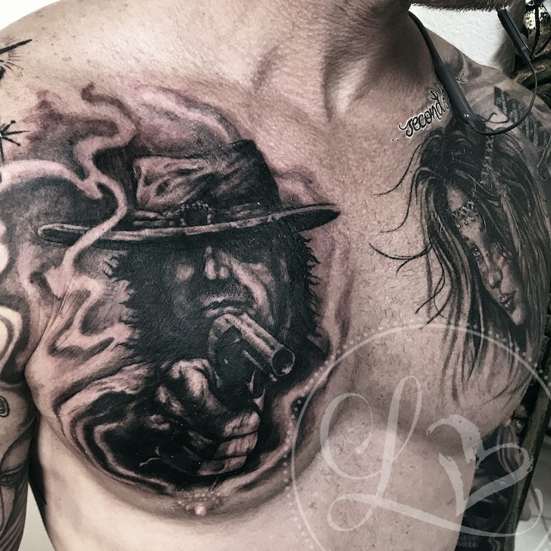 cowboy indian portrait chest tattoo black and grey