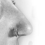 Double tiered nostril piercing with 18g fixed bead ring