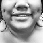 Fresh cheek or "dimple" piercings with 14g standard ball labrets - done by Lhena - Queen of Hearts, Wailuku, Maui. Upper lip "monroe" piercing not by QOH.