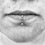 Vertical labret piercing with a 16g crystal-topped curved barbell - done by Lhena - Queen of Hearts, Wailuku, Maui