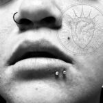 Double lower lip piercing - "spider bites" - with a pair of 16g gem-ball labrets - done by Lhena - Queen of Hearts, Wailuku, Maui