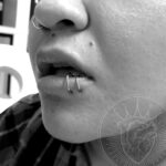 Double lower lip piercing - "spider bites" - with a pair of 16g fixed bead rings - done by Lhena - Queen of Hearts, Wailuku, Maui
