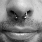 Septum piercing with a 14g circular barbell