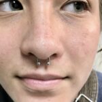 Septum piercing with a 16g circular barbell