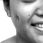 Sideview of fresh cheek / "dimple" piercing with 14g standard ball labret - done by Lhena - Queen of Hearts, Wailuku, Maui.