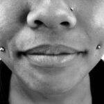 Fresh cheek or "dimple" piercings with 14g standard ball labrets - done by Lhena - Queen of Hearts, Wailuku, Maui.