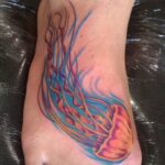 Jellyfish color foot tattoo - by QOH tattoo artist Leilani